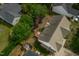 Aerial view of a home with a wooden deck and lush backyard at 7109 Spanglers Spring Way, Raleigh, NC 27610