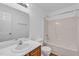 Clean bathroom with wood vanity and shower-tub combination at 7109 Spanglers Spring Way, Raleigh, NC 27610