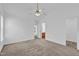 Open bedroom with ceiling fan and an ensuite bathroom at 7109 Spanglers Spring Way, Raleigh, NC 27610