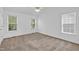 Large bedroom with multiple windows and ceiling fan at 7109 Spanglers Spring Way, Raleigh, NC 27610