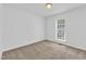 Cozy bedroom with neutral carpeting and one window at 7109 Spanglers Spring Way, Raleigh, NC 27610