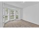 Bedroom features a bay window and neutral carpeting at 7109 Spanglers Spring Way, Raleigh, NC 27610