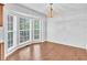 Bright dining room features a bay window and chandelier lighting at 7109 Spanglers Spring Way, Raleigh, NC 27610