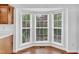 Bright dining room with a bay window looking out onto the yard at 7109 Spanglers Spring Way, Raleigh, NC 27610