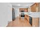 Spacious kitchen features wood cabinets and modern appliances at 7109 Spanglers Spring Way, Raleigh, NC 27610