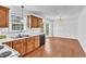Functional kitchen featuring wood cabinets, laminate countertops, and ample natural light at 7109 Spanglers Spring Way, Raleigh, NC 27610