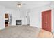 Spacious living room with a fireplace, carpeted floors, and abundant natural light at 7109 Spanglers Spring Way, Raleigh, NC 27610