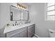 Well-lit bathroom with double sinks, a large mirror, and a modern aesthetic at 827 Lockesley Ln, Burlington, NC 27217