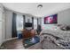 Cozy bedroom featuring dark wood flooring, a ceiling fan, and window with natural light at 827 Lockesley Ln, Burlington, NC 27217