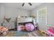 bedroom with a bunk bed, playful decor, and a window with natural light at 827 Lockesley Ln, Burlington, NC 27217