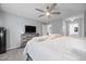 Neutral Primary bedroom featuring a ceiling fan, carpeted floors, and ensuite bathroom at 827 Lockesley Ln, Burlington, NC 27217