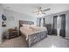Spacious main bedroom with wooden furniture, carpeted floors, and bright natural light at 827 Lockesley Ln, Burlington, NC 27217