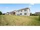Spacious backyard featuring a well-maintained lawn and a charming two-story home, perfect for outdoor enjoyment at 912 Beech Glen Dr, Mebane, NC 27302