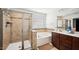 Primary bath featuring a large shower, soaking tub, and a double sink vanity at 912 Beech Glen Dr, Mebane, NC 27302