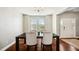 Bright dining room featuring hardwood floors, modern chandelier, and lots of natural light at 912 Beech Glen Dr, Mebane, NC 27302