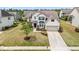 Two-story home featuring a two-car garage, neutral siding, and a manicured lawn at 912 Beech Glen Dr, Mebane, NC 27302