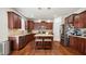 Modern kitchen featuring stainless steel appliances, granite countertops, and ample cabinet space at 912 Beech Glen Dr, Mebane, NC 27302