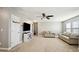 Spacious living room featuring neutral walls, a ceiling fan, and carpeted floors at 912 Beech Glen Dr, Mebane, NC 27302