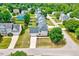 Aerial rear view of a two-story house with lawn at 1009 Sarazen Dr, Clayton, NC 27527