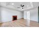 Spacious bedroom features hardwood floors, fireplace, recessed lights and a ceiling fan at 1009 Sarazen Dr, Clayton, NC 27527