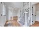 Bright foyer with hardwood floors, staircase, and elegant white trim at 1009 Sarazen Dr, Clayton, NC 27527