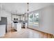 Modern eat-in kitchen with stainless steel appliances, center island, and an abundance of natural light at 1009 Sarazen Dr, Clayton, NC 27527