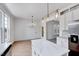 Open kitchen with stainless appliances, center island, and eat-in area with views of the back yard at 1009 Sarazen Dr, Clayton, NC 27527