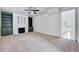 Bright living room featuring built-in shelving, a cozy fireplace, and a neutral color palette at 1009 Sarazen Dr, Clayton, NC 27527