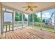 Screened in porch with wooded floor and backyard view at 1009 Sarazen Dr, Clayton, NC 27527