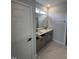 Modern bathroom with double vanity, undermount sinks, granite counters and neutral color palette at 1010 Westerland Way # 200, Durham, NC 27703