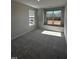 Bedroom with soft gray carpet and two large windows, offering natural light and scenic views at 1010 Westerland Way # 200, Durham, NC 27703