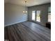 Bright dining room with chandelier and sliding glass doors at 1010 Westerland Way # 200, Durham, NC 27703
