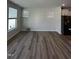 Open-concept living room with lots of natural light and hardwood floors at 1010 Westerland Way # 200, Durham, NC 27703