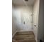 Neutral mudroom with plank floors and white doors at 1010 Westerland Way # 200, Durham, NC 27703
