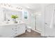 Bright bathroom featuring a double vanity, quartz countertop, modern fixtures, and glass enclosed shower at 103 Mable Ct # 25P, Lillington, NC 27546