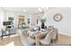 Open-concept living and dining area with stylish furniture, ample natural light, and modern decor elements at 103 Mable Ct # 25P, Lillington, NC 27546