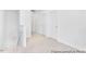 Hallway boasts neutral carpet, white doors and walls, and staircase with white banister at 103 Mable Ct # 25P, Lillington, NC 27546