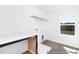 Well-lit laundry room with white countertop, wood cabinets, window, and vinyl flooring at 103 Mable Ct # 25P, Lillington, NC 27546