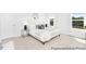 Bright bedroom with neutral carpet, large windows, a comfortable bed, and modern furnishings at 103 Mable Ct # 25P, Lillington, NC 27546