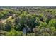 Aerial shot showcases a home nestled among lush greenery with a long driveway at 105 Oak Ridge Rd, Franklinton, NC 27525