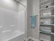 Bathroom featuring a white bathtub, a shower with a shower head, and a shelf at 105 Oak Ridge Rd, Franklinton, NC 27525