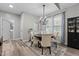 Inviting dining room features a chandelier, modern decor, and natural light at 105 Oak Ridge Rd, Franklinton, NC 27525