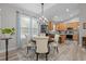 Bright dining area features a modern chandelier, round wood table, and an area rug at 105 Oak Ridge Rd, Franklinton, NC 27525