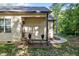 Charming entrance with a cozy porch, decorative flower pots, and a well-manicured garden at 105 Oak Ridge Rd, Franklinton, NC 27525