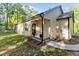 Charming entrance with a cozy porch, decorative flower pots, and a well-manicured garden at 105 Oak Ridge Rd, Franklinton, NC 27525
