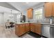 Open concept kitchen featuring light wood cabinets, stainless steel appliances, and dining area at 105 Oak Ridge Rd, Franklinton, NC 27525