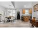 Bright dining and kitchen area featuring hardwood floors and natural lighting at 105 Oak Ridge Rd, Franklinton, NC 27525