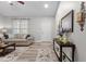 Bright living room showcases neutral colors, hardwood floors, stylish decor, and comfortable seating at 105 Oak Ridge Rd, Franklinton, NC 27525