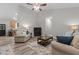Neutral living room with plenty of natural light, hardwood floors, ceiling fan, and open floor plan at 105 Oak Ridge Rd, Franklinton, NC 27525