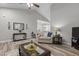 Cozy living room with vaulted ceilings, neutral paint, wood-look floors, and modern decor at 105 Oak Ridge Rd, Franklinton, NC 27525